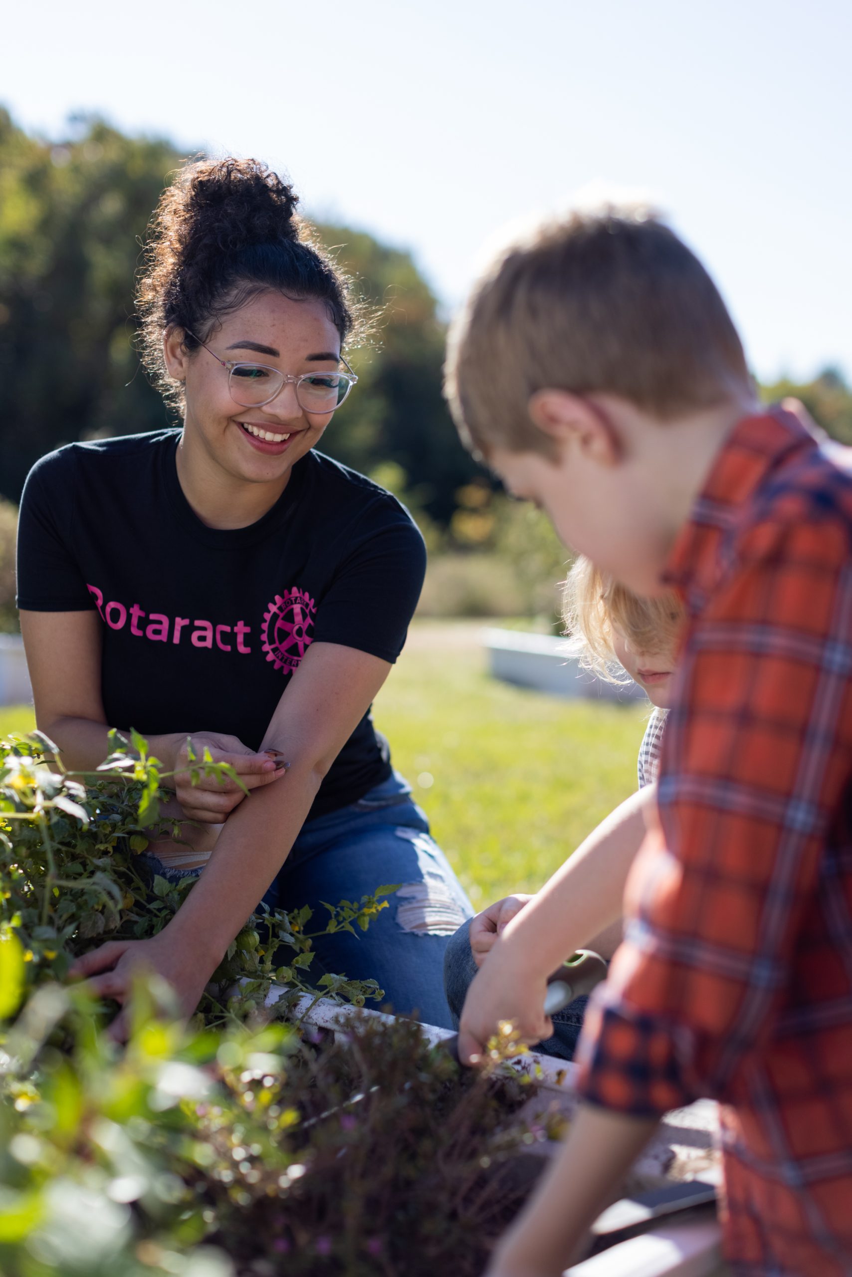 Members of Rotary clubs in the Houston area work in a community garden built by the Rotaract Club of Seabrook at Evelyn Meador Branch Library in Seabrook, Texas, USA. 14 November 2021.